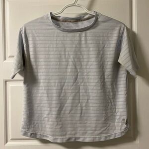 Women’s New Balance baby blue activewear t-shirt